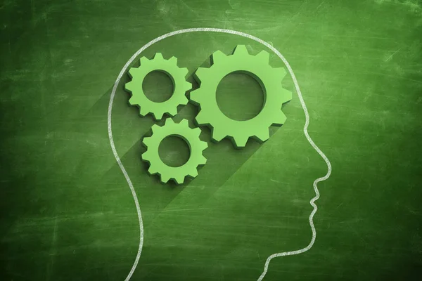 Head shape with cogwheel on blackboard — Stock Photo, Image