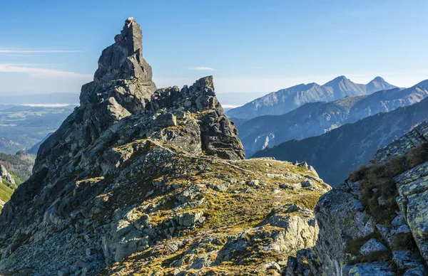 Monk\'s peak in the Polish Tatra Mountains. View in the morning. A peak visited by mountaineers and guides with clients.