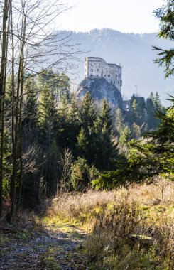 Likavka, Slovakia - November 17, 2018: The trail leading to the ruins of the royal castle - Hrad Likava. clipart