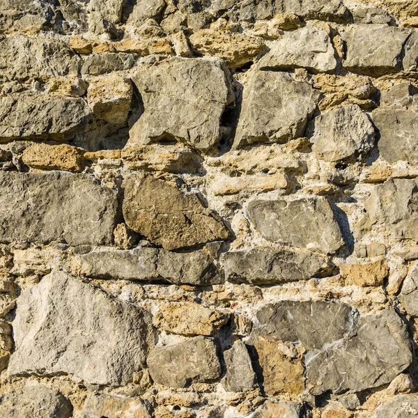 Stone castle wall from the Middle Ages - close up on the texture.