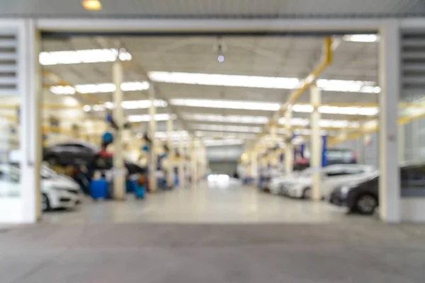 Desenfoque abstracto del servicio de reparación de automóviles en el garaje. uso de fondo — Foto de Stock