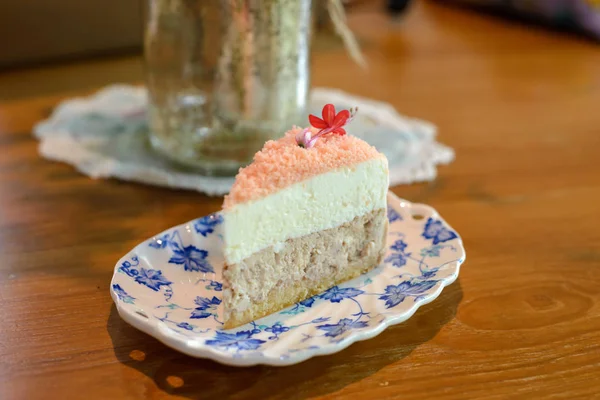 Piece of homemade taro cake in classic plate on table with copy space for text — Stock Photo, Image