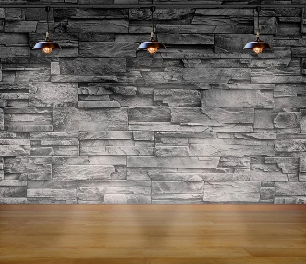 Lege kamer-granieten stenen decoratieve bakstenen muur met drie lampen en laminaatvloeren interieur achtergrond, interieur sjabloon voor product weergave — Stockfoto