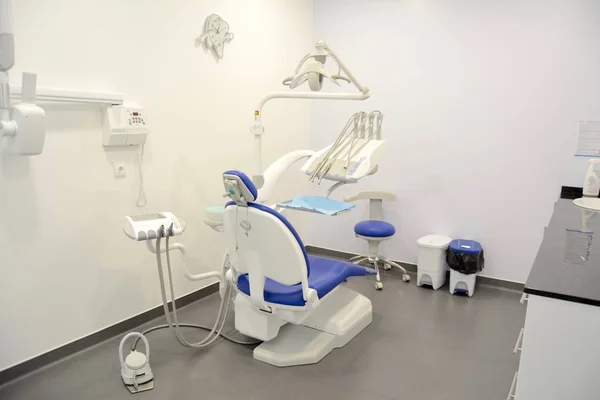 Modern dental practice. Dental chair and other accessories.