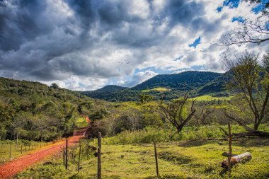 Typical red sand path in Paraguay: here, from the Colonia Independencia to the Ybytyruzu mountains. clipart