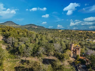 Aerial view of a castle in Paraguay overlooking the Ybytyruzu Mountains. clipart