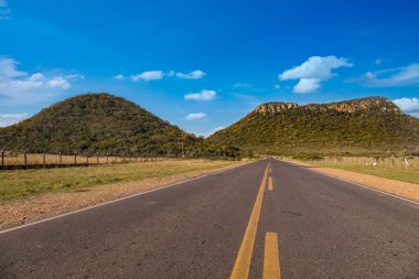 Cerro Jh (Cerro Negro) is one of the visual landmarks of the city of Paraguari in Paraguay. One of the best known landscapes is the route that connects this town with Piribebuy, which runs between this hill and the Cerro de la Artillera. clipart