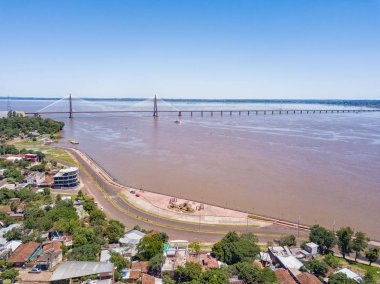 Aerial view of Encarnacion in Paraguay overlooking the bridge to Posadas in Argentina. clipart