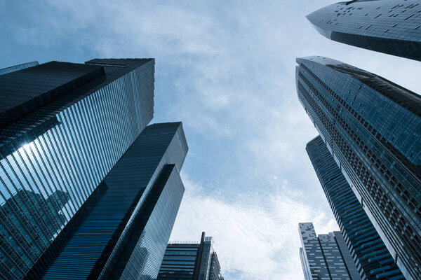 Bottom view to modern skyscrapers at downtown district. Business landscape background. Singapore city