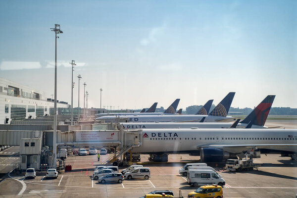 Brussels, Belgium - June 23, 2019: Planes of Delta Air Lines and United Airlines are parked near jet bridges in Brussels international airport