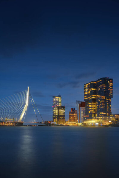 Rotterdam city skyline cityscape, Netherlands (Holland) at night. View of downtown and Erasmus bridge