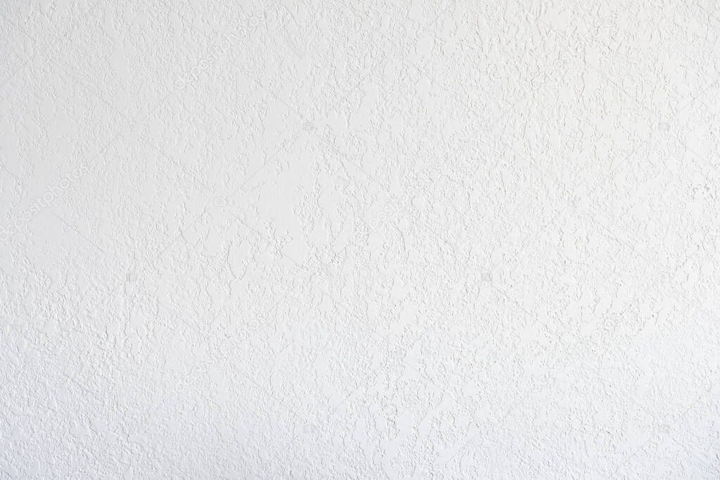 The texture of the wall is light, plaster, embossed, finishing