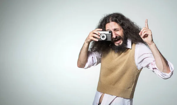 Portrait of a skinny man taking a photo — Stock Photo, Image