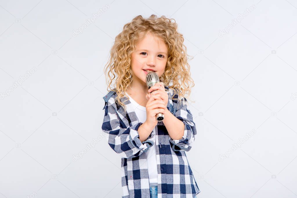 cute young girl with microphone in studio