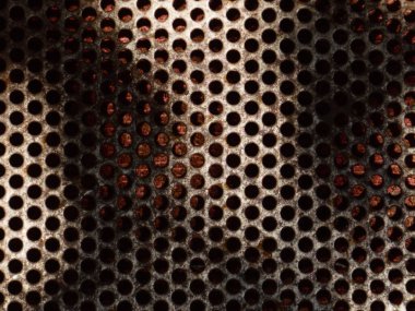 Eski, paslı bir metal şebeke dokusunun makro görüntüsü..