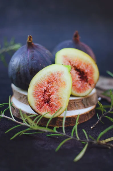 Fresh figs on a dark background on a table