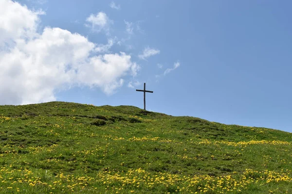 Holy cross on a hill in Flumserberg in Switzerland 17.5.2020