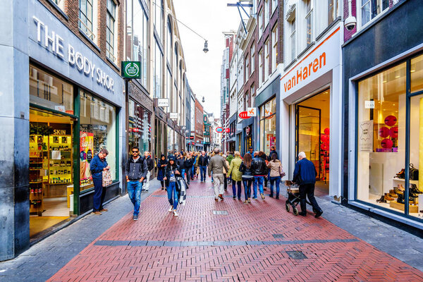 Amsterdam, the Netherlands - Sept 28, 2018: Tourists and locals in the busy Niewendijk shopping street in the historic center of Amsterdam