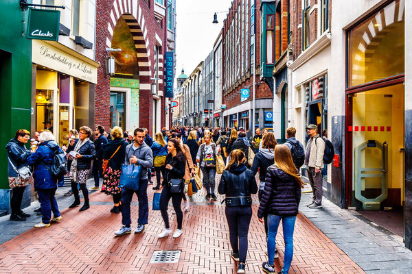 Amsterdam, the Netherlands - Sept 28, 2018: Tourists and locals in the busy Niewendijk shopping street in the historic center of Amsterdam