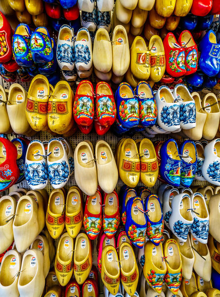 Amsterdam, Noord Holland/the Netherlands - Oct. 3 2018: Colorful Wooden Shoes at a souvenir shop the famous Bloemenmarkt (Flower Market) along the Singel Canal in the center of Amsterdam
