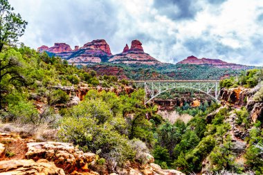 The steel structure of Midgely Bridge on Arizona SR89A between Sedona and Flagstaff. The bridge span crosses Wilson Canyon where it joins the Oak Creek Canyon just north of Sedona in northern Arizona clipart