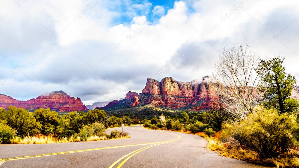 The colorful sandstone mountains of Twin Buttes and Munds Mountain near the town of Sedona in northern Arizona in Coconino National Forest, USA