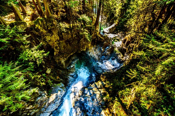 The turquoise waters of Cascade Falls in Cascade Falls Regional Park between the towns of Mission and Deroche in British Columbia, Canada