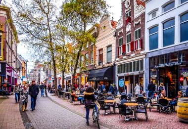 Zwolle, Overijsel/the Netherlands - Oct. 4, 2018: Terrasses line the busy shopping street named Diezerstraat in the center of the historic hanseatic city of Zwolle