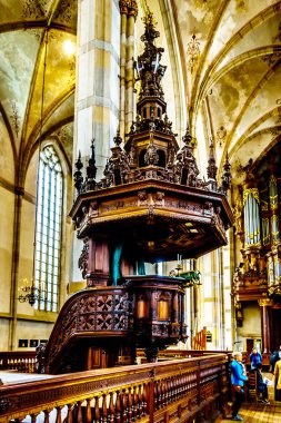 Zwolle, Overijsel/the Netherlands - Oct. 4, 2018: The richly carved pulpit, the work of Adam Straes van Weilborch (about 1620) in the 13th century romanesque St. Michael's Church
