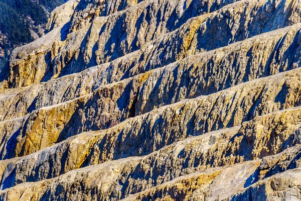 Closeup of the terraced mountain side of a limestone Quarry in Marble Canyon Provincial Park along Highway 99 between the towns of Cache Creek and Lillooet in Southern British Columbia, Canada