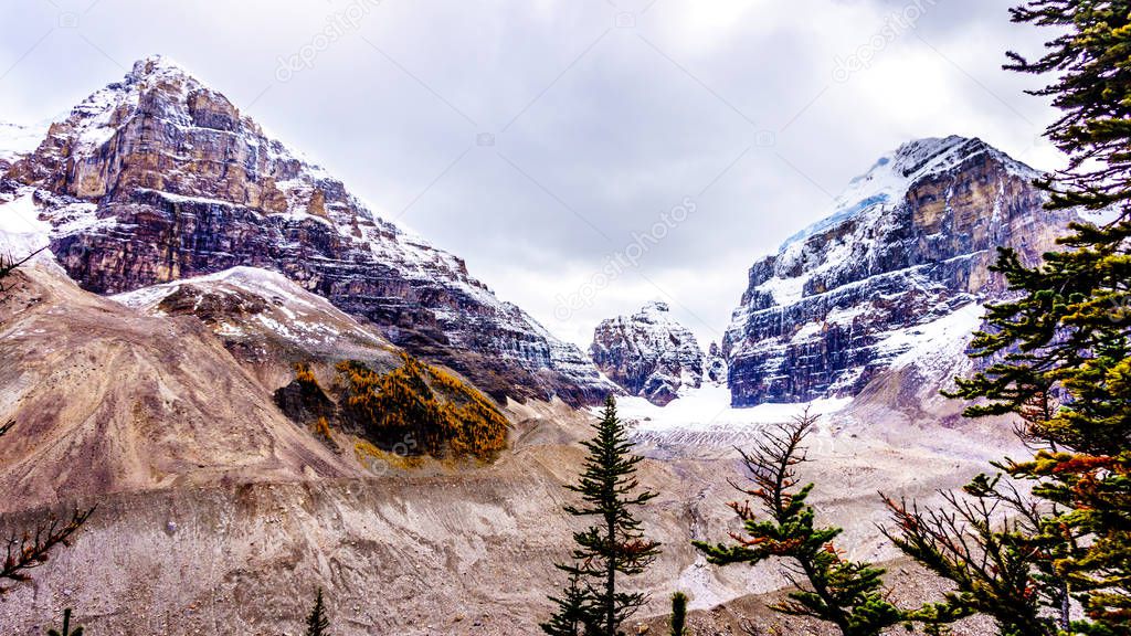 View of peaks in the Rocky Mountains at the Plain of Six Glaciers near the Victoria Glacier. Viewed from the hiking trail from the Teahouse to Plain of Six Glaciers at Lake Louise, Banff National Park