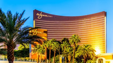 Las Vegas, Nevada/USA - June 8, 2019: Late afternoon sun reflecting on the Glass of the modern building of Wynn Resort and Casino on Las Vegas Blvd, also called 'The Strip'