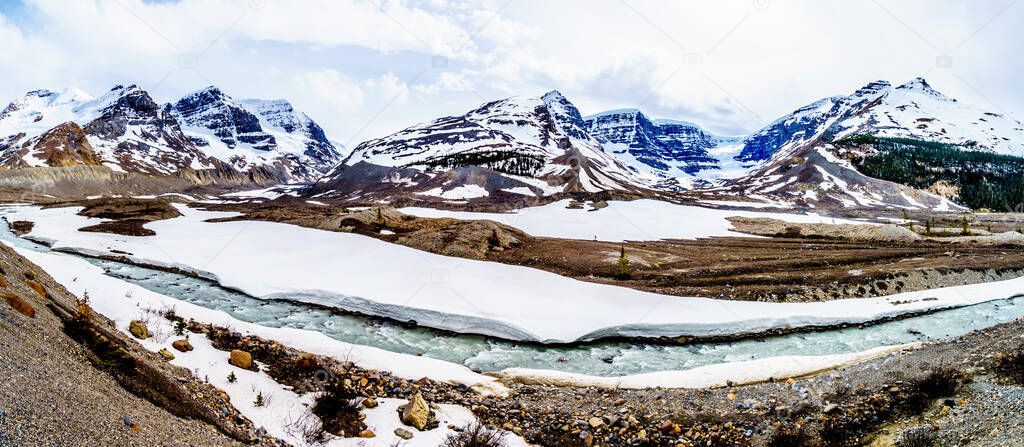 Panorama View of the Athabasca Glacier and Dome Glacier in the Columbia Icefields flowing into the Athabasca River in Jasper National Park, Alberta, Canada at spring time