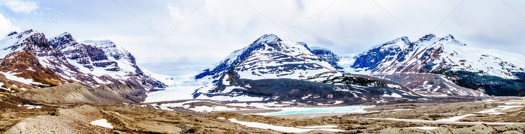 Panorama View of the Columbia Icefields in Jasper National Park, Alberta, Canada at spring time. The famous Athabasca Glacier on the left