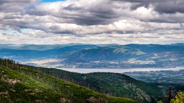 View of the city of Kelowna on the Shores of Lake Okanagan seen from the abandoned Kettle Valley Railway in Myra Canyon near Kelowna, British Columbia, Canada clipart