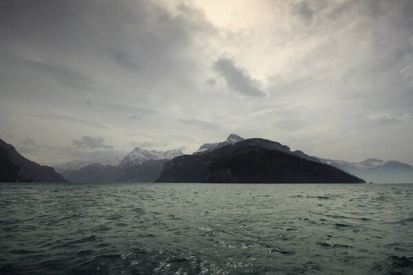Climate change, flooding, cloudy day nearby High mountain landscape, strong cold and frost on White winter, travel destination during vacation, backgrounds