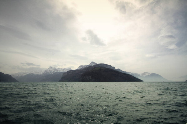 Climate change, flooding, cloudy day nearby High mountain landscape, strong cold and frost on White winter, travel destination during vacation, backgrounds