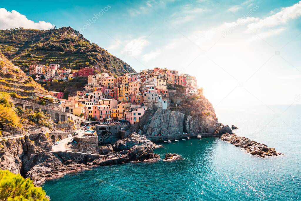 Small town on the rocks by the sea with a bay and boats