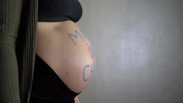 Pregnant Woman Rotates Inscription Made China Her Belly — Stock Video