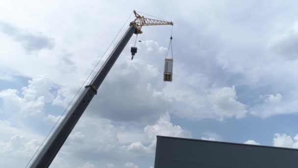 Aerial View Crane Manipulator Construction Site Lifts Load — Stock Video