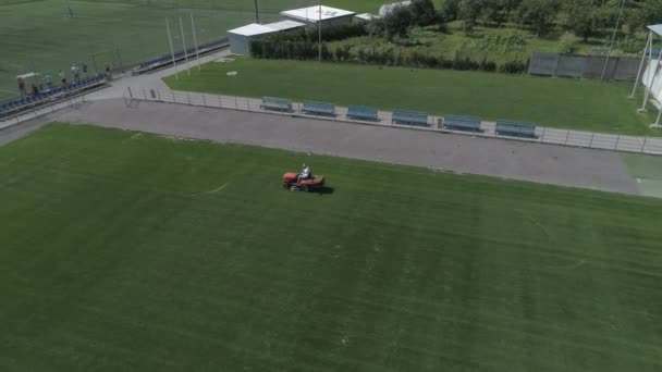 Maintenance Football Field Lawn Mower Cutting Green Grass Aerial View — Stockvideo