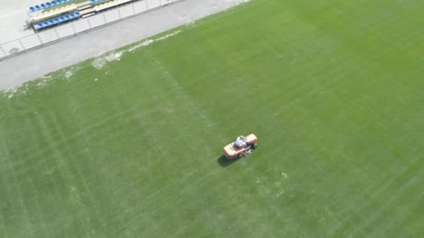 Maintenance Football Field Lawn Mower Cutting Green Grass Aerial View — ストック動画