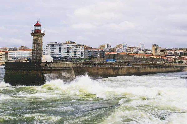 Old stone lighthouse and ocean view in Porto
