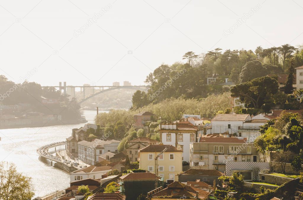 Beautiful Porto cityscape with river bridge  and boats 