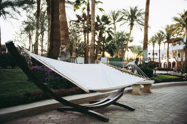 White hammock outdoor near palms — Stock Photo, Image