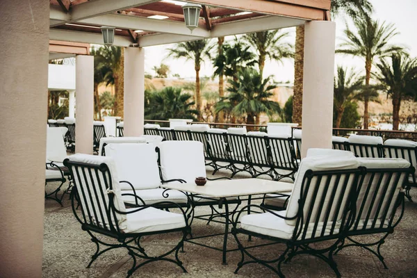 White chairs and table outdoor with sea view — 스톡 사진