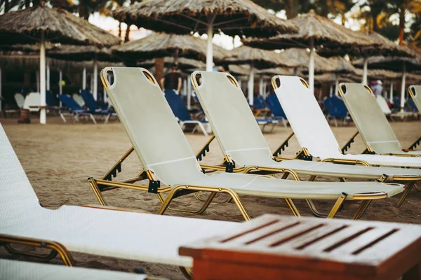 Loungers on the beach on sand — Stock Photo, Image