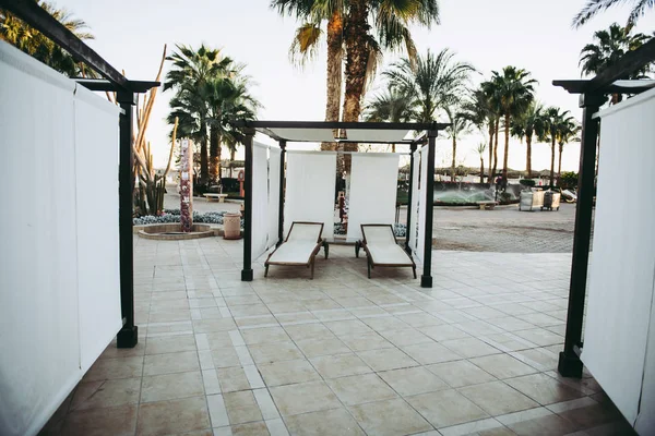 White luxury  loungers near pool — Stock Photo, Image