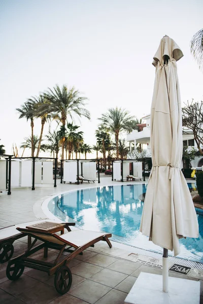 White luxury  loungers near pool — Stock Photo, Image