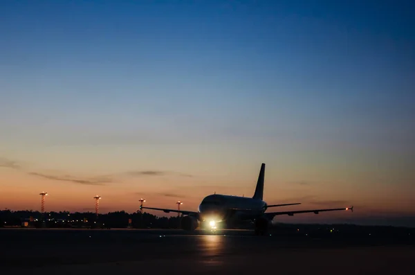 Big Aircraft in airport while sunrise — Stock Photo, Image